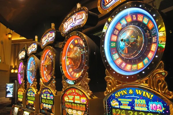 Gem Saviour slot game interface showing five-reel layout with gem symbols and payout table